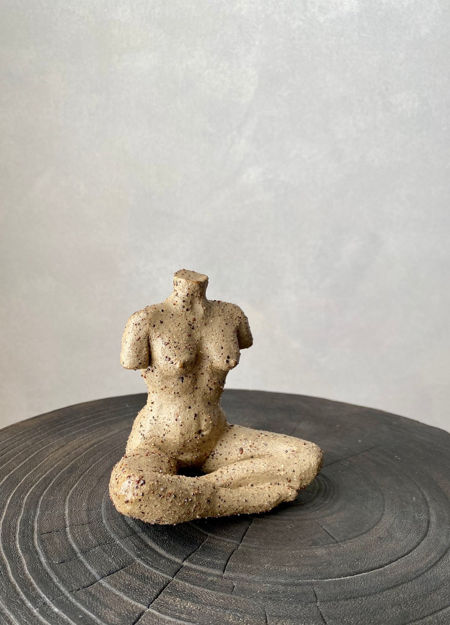 Nude | cross legged