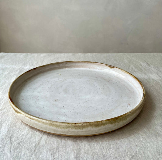 Platter with speckled and layered drip glaze