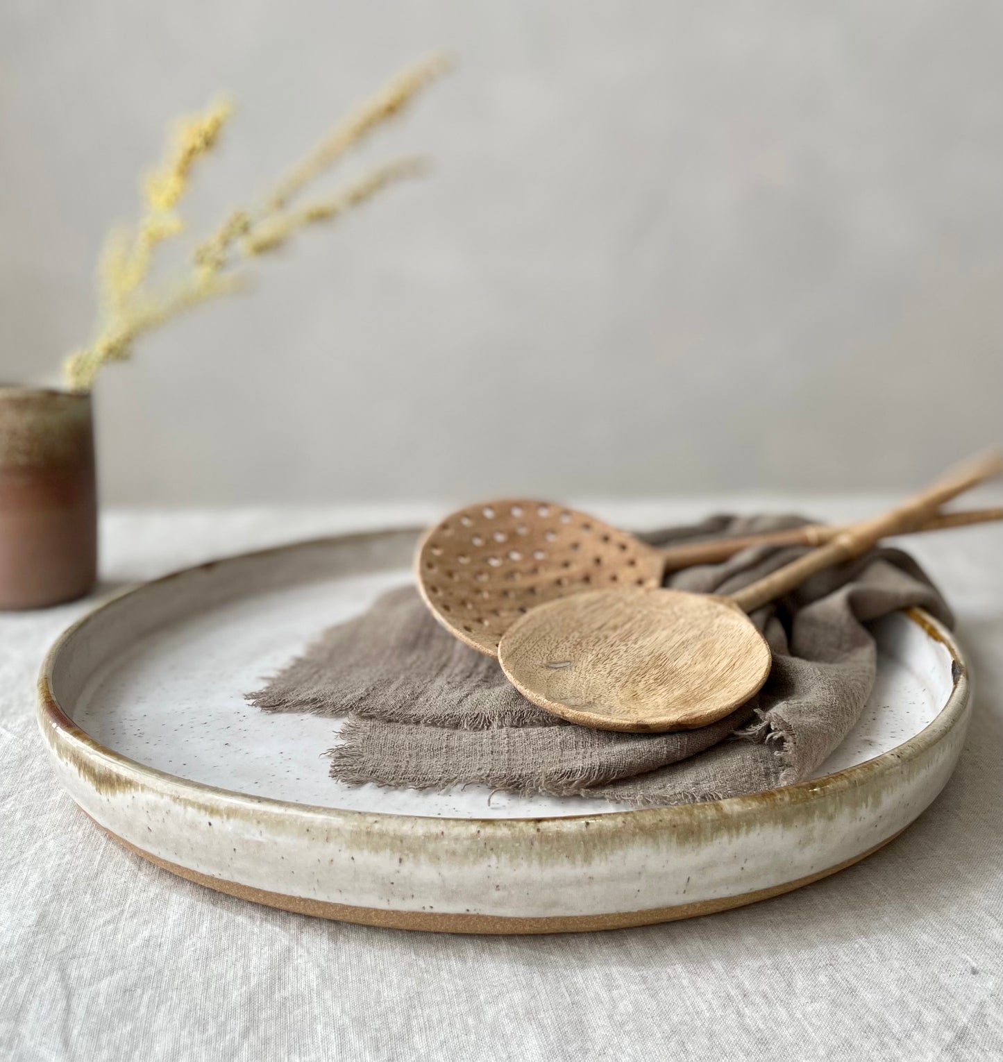 Platter with speckled and layered drip glaze